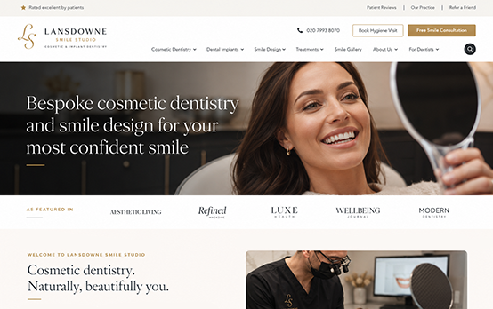 Cosmetic dentistry homepage design with smile makeover hero image, premium clinic branding and featured publication logos.