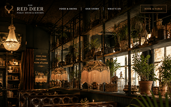 Atmospheric London pub website design with dark interior photography and clear food and drink navigation
